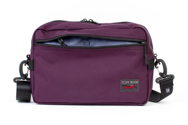 The Side Hustle in Aubergine Ballistic with Dusk 210 Cerylon interior.